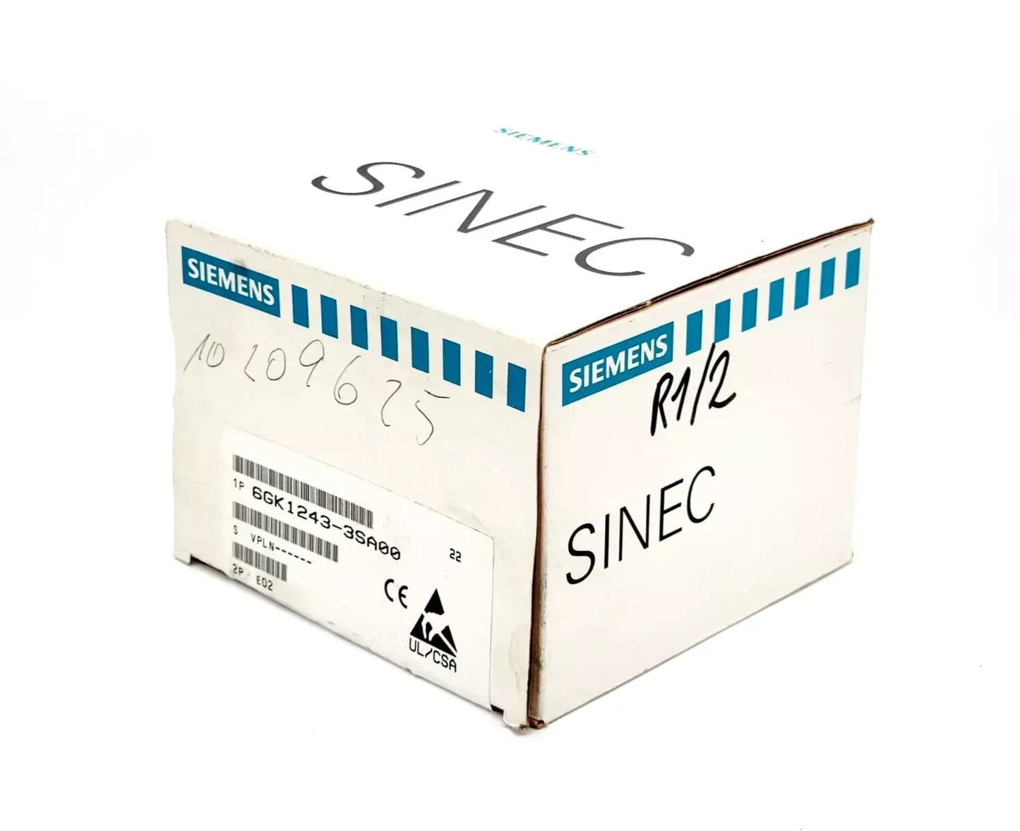 Sealed Siemens 6GK1243-3SA00 SINEC CP 2433 communication processor box with product labeling and logo visible.
