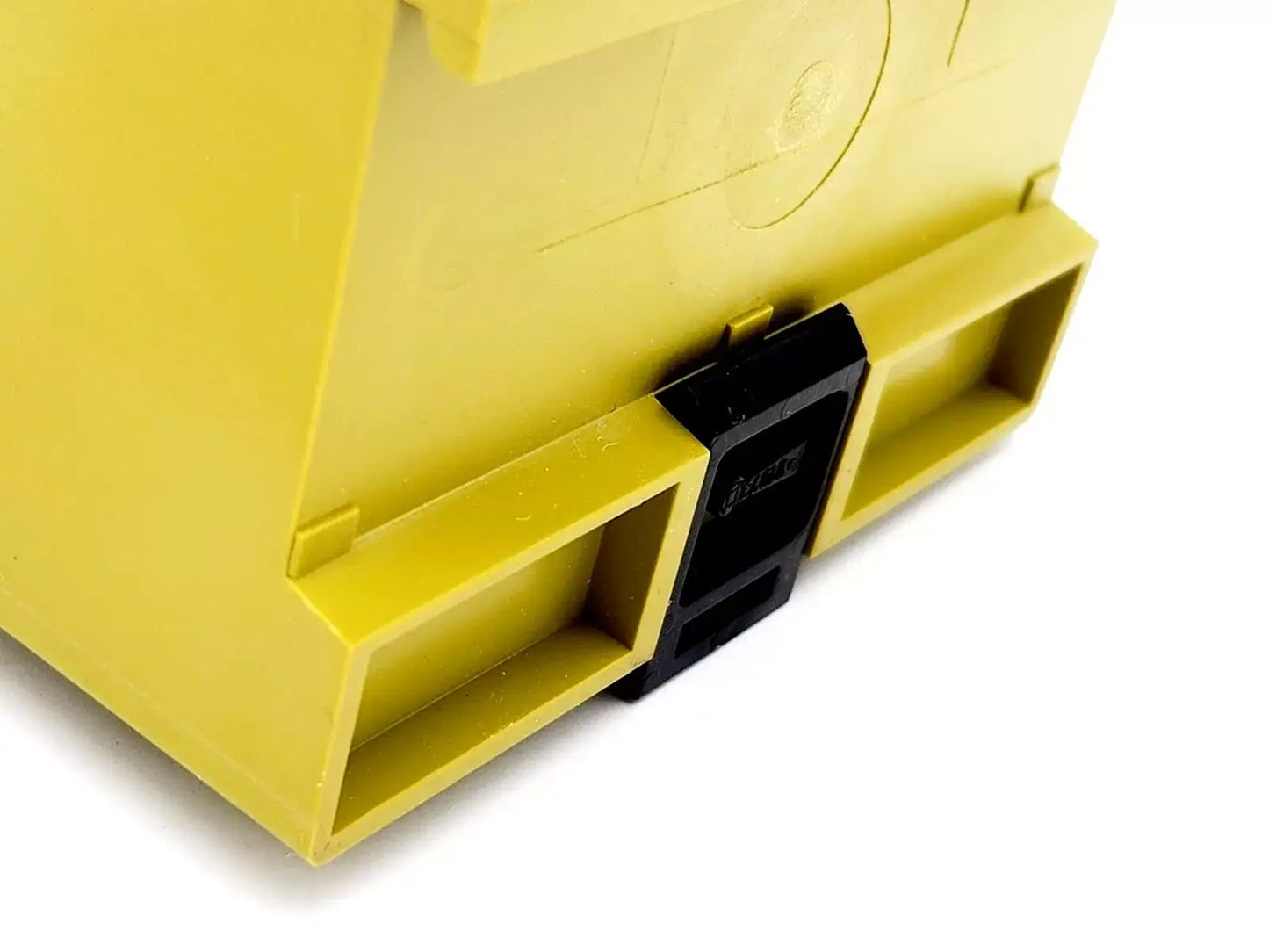 Close-up of Pilz 474910 PZE 5 safety relay device showing yellow casing and connectors, used for safety contact expansion, 24V DC model.