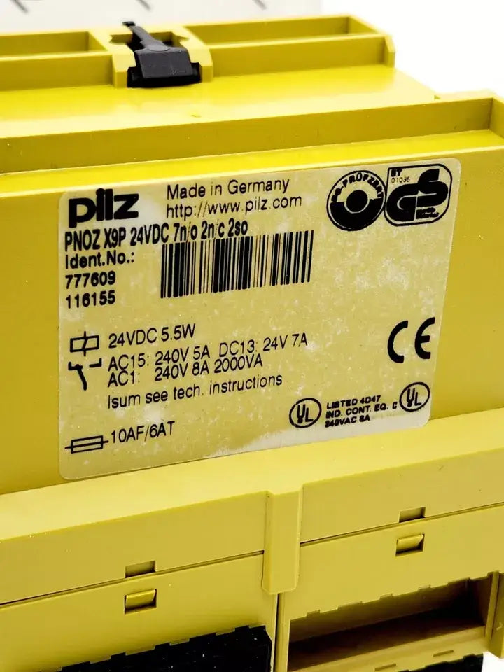 Pilz 777609 PNOZ X9P safety relay module, label close-up showing specifications, yellow casing, Made in Germany.