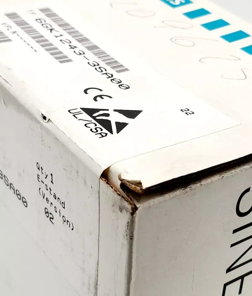 Close-up of sealed box of Siemens 6GK1243-3SA00 SINEC CP 2433 Kommunikationsprozessor with visible labels and codes.