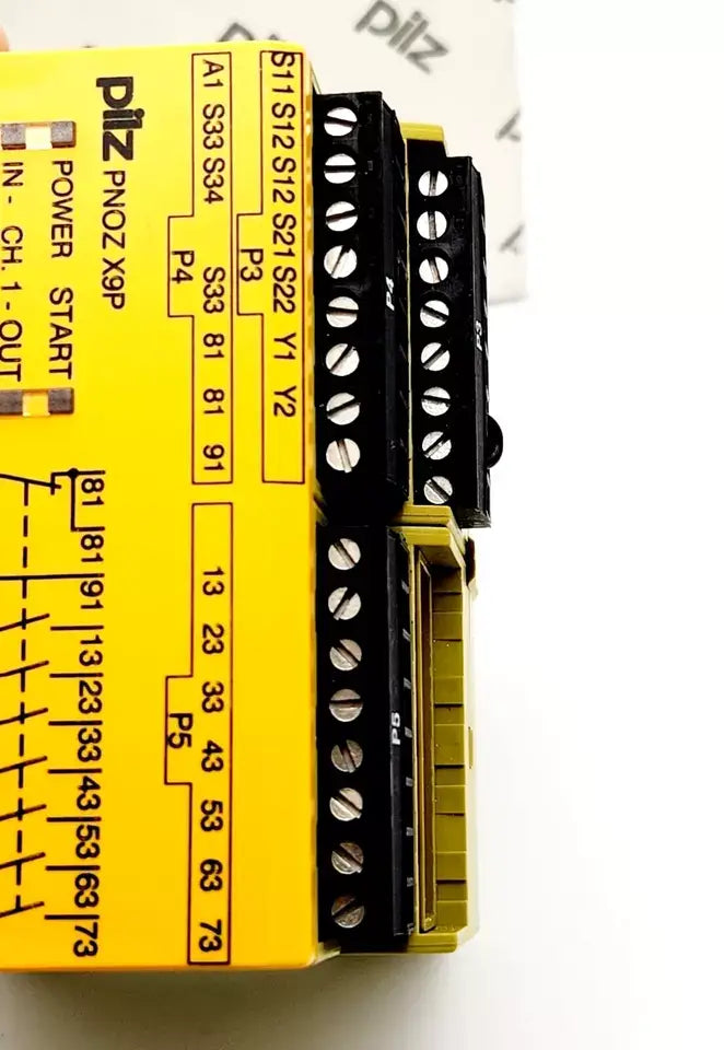 Pilz 777609 PNOZ X9P safety relay with terminal connections for versatile safety applications, side view.
