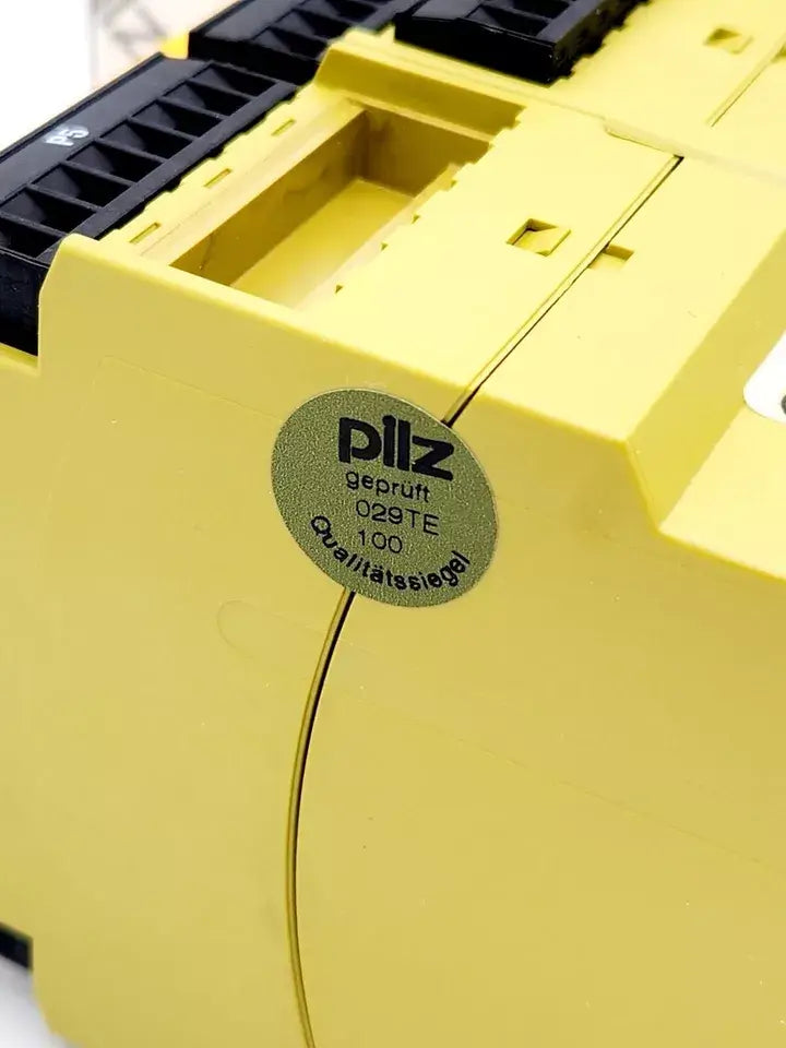 Close-up of Pilz 777609 PNOZ X9P safety relay with quality seal, suitable for various safety applications, 24VDC output.