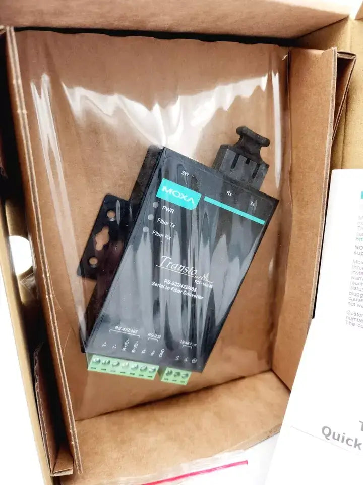Moxa TCF-142-M-SC-T media converter in original packaging, featuring RS-232 RS-485 interfaces and SC multimode connection.