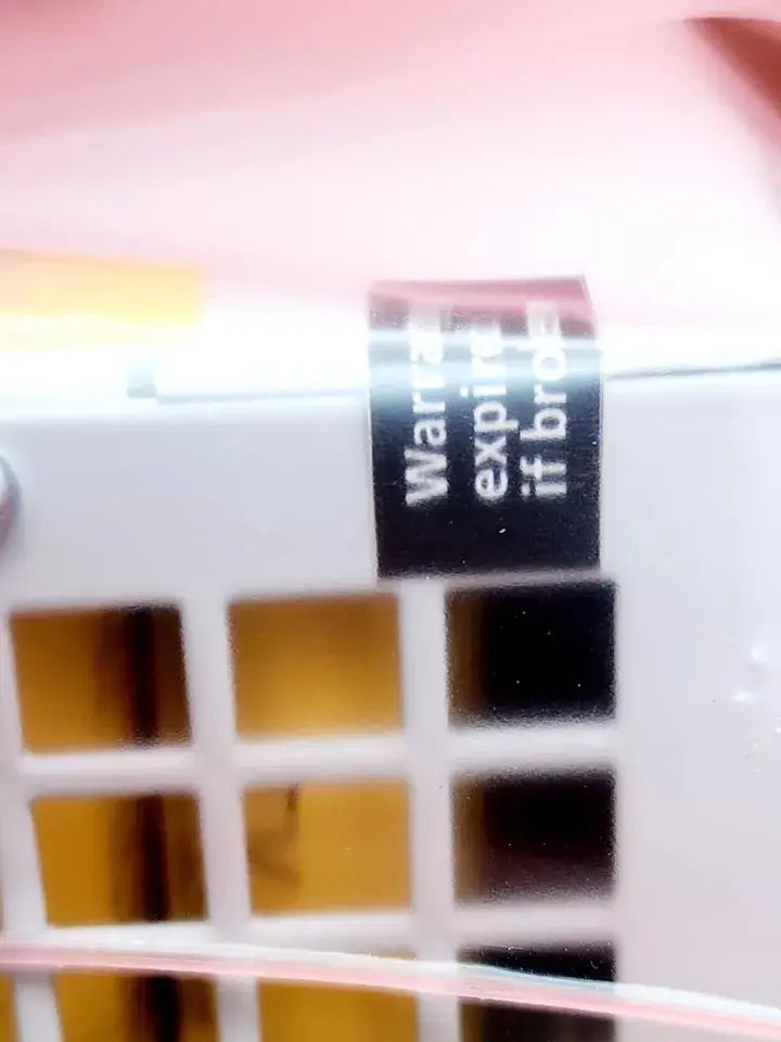 Close-up of warranty label on electronic device, ABB 1SVR427060R0300 CP-B 24/3.0 Puffermodul 24 V / 3 A, Energiespeicher 1000 Ws.