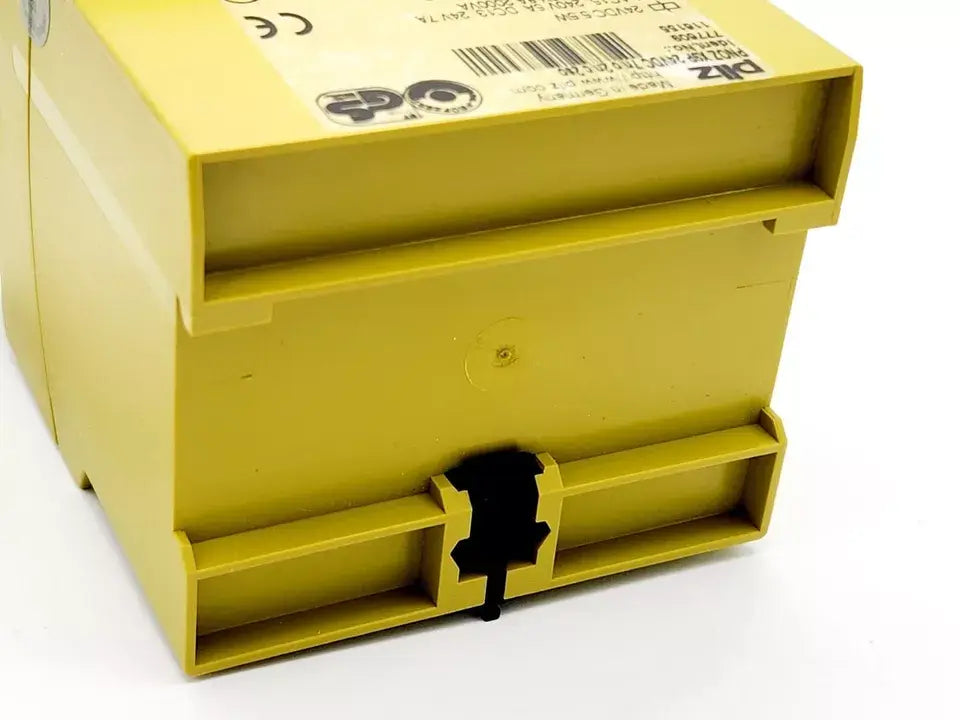 Pilz 777609 PNOZ X9P Sicherheitsschaltgerät 24VDC 7n/o 2n/c 2so, close-up view of safety relay device in yellow casing.