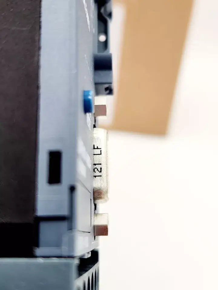 Close-up of Siemens 3UF7010-1AB00-0 Grundgerät SIMOCODE pro V PB, showing digital interface connectors for PROFIBUS DP.
