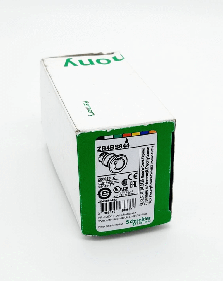 Box of Schneider Electric 088886 ZB4BS844 Not-Aus/Not-Halt-Schalter, Metall 22mm, rot, with product details and packaging.