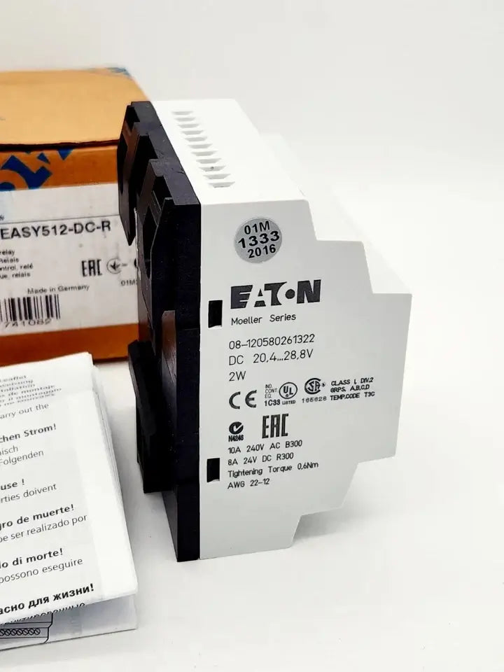 Eaton Moeller EASY512-DC-R compact control relay, 24V DC, 8 digital inputs, 4 relay outputs, part number 274108, packaging in background.