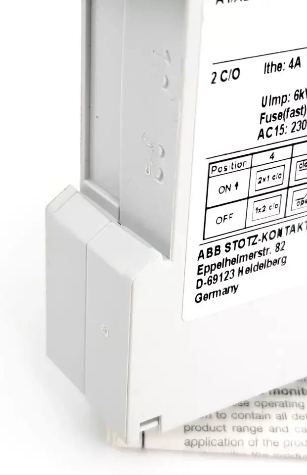 Side view of ABB CM-TCS.11S temperature monitoring relay showing configuration details and LED display panel.
