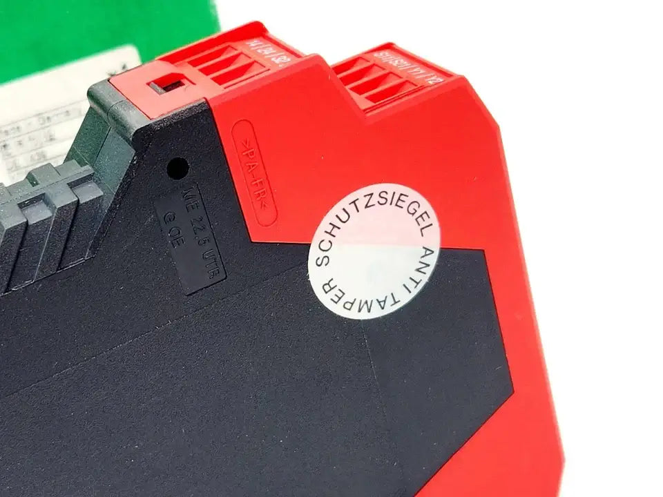 Schneider Electric Preventa XPSBCE3710P safety relay with protective seal sticker, red and black design.