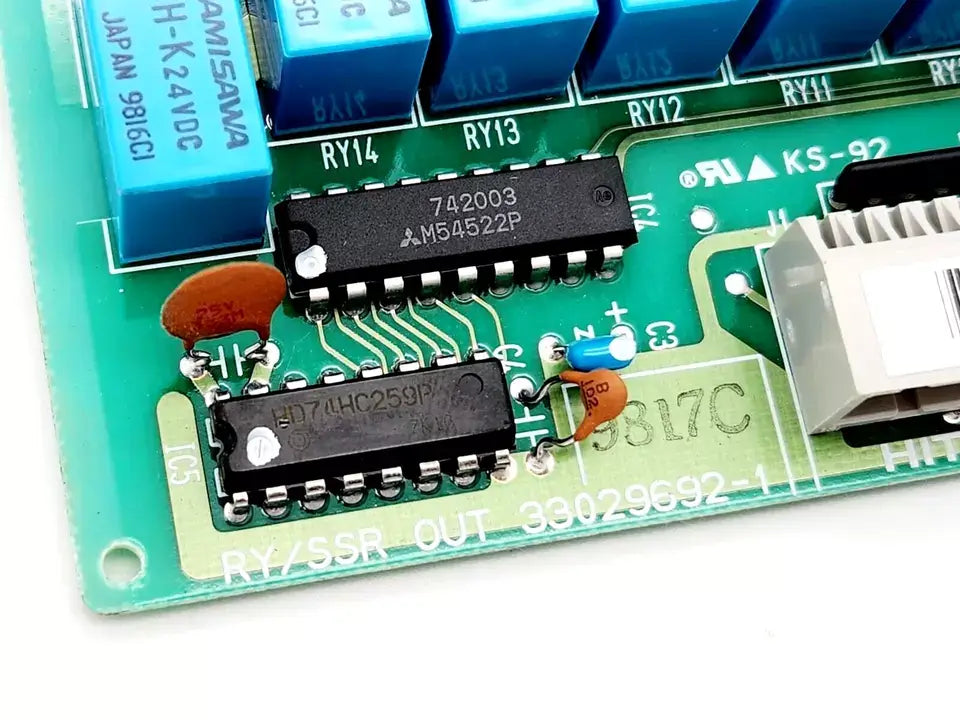 Close-up of Hitachi RY/SSR OUT 33029692-1 POM-RBH Programmable Controller circuit board with components and labels visible.