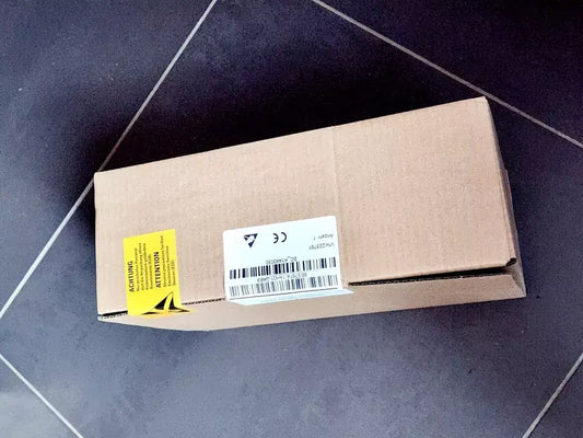 Sealed box of Siemens 6ES7614-1AH01-0AB3 SIMATIC S7 Branchen-CPU 614 on dark tile floor