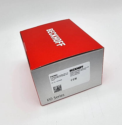 Red box containing Beckhoff KM2604 Busklemmenmodul 4-Kanal-Relais-Ausgang 230 VAC 16A | sealed, showcasing original packaging.