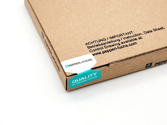 Pepperl+Fuchs packaging detail showing quality seal and brand label on cardboard box.