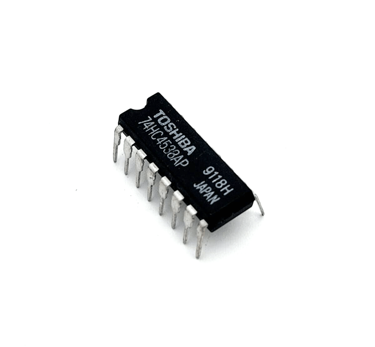 Toshiba 74HC4538AP Integrated Circuit IC, DIP16 package, black with silver pins, top view.