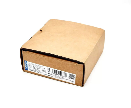 Packaging box of Omron E5DC-QX2DBM-002 Digital Temperature Controller with label visible.