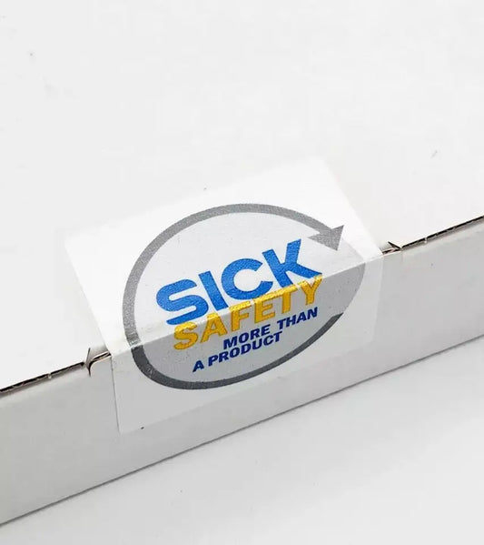 Sealed packaging of Sick Safety product with logo and slogan "More Than a Product" displayed.