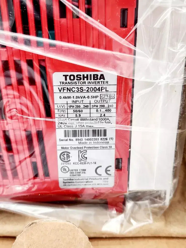 Close-up of TOSHIBA VFNC3S-2004PL inverter label showing technical specifications and certification details.