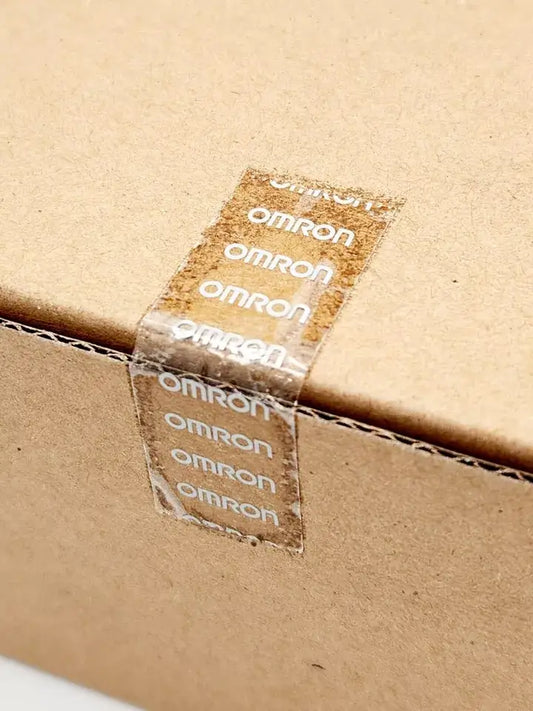 Sealed box of Omron CP1W-CIF41 PLC Interface Unit Version 2.0 showcasing packaging tape with logo.