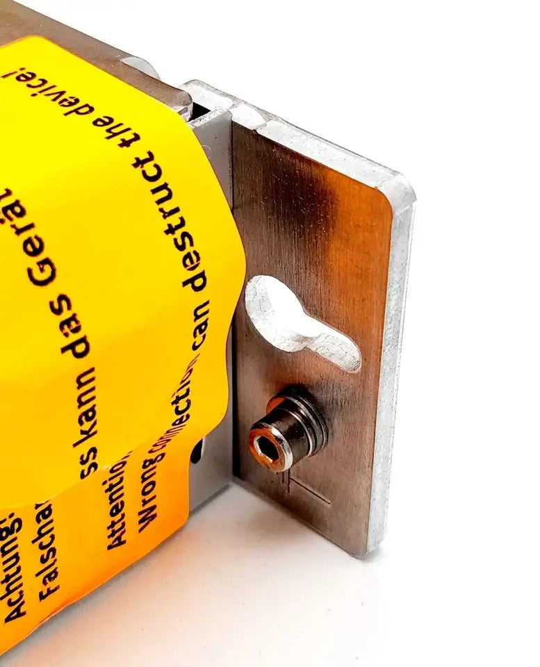 Close-up of Festo 572211 Motorcontroller CMMS-ST-C8-7-G2, showing mounting detail with yellow warning label.