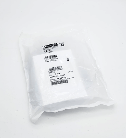 Sealed packaging of Phoenix Contact 2902040 MINI MCR-2-UI-UI-PT isolating amplifier with product label visible.