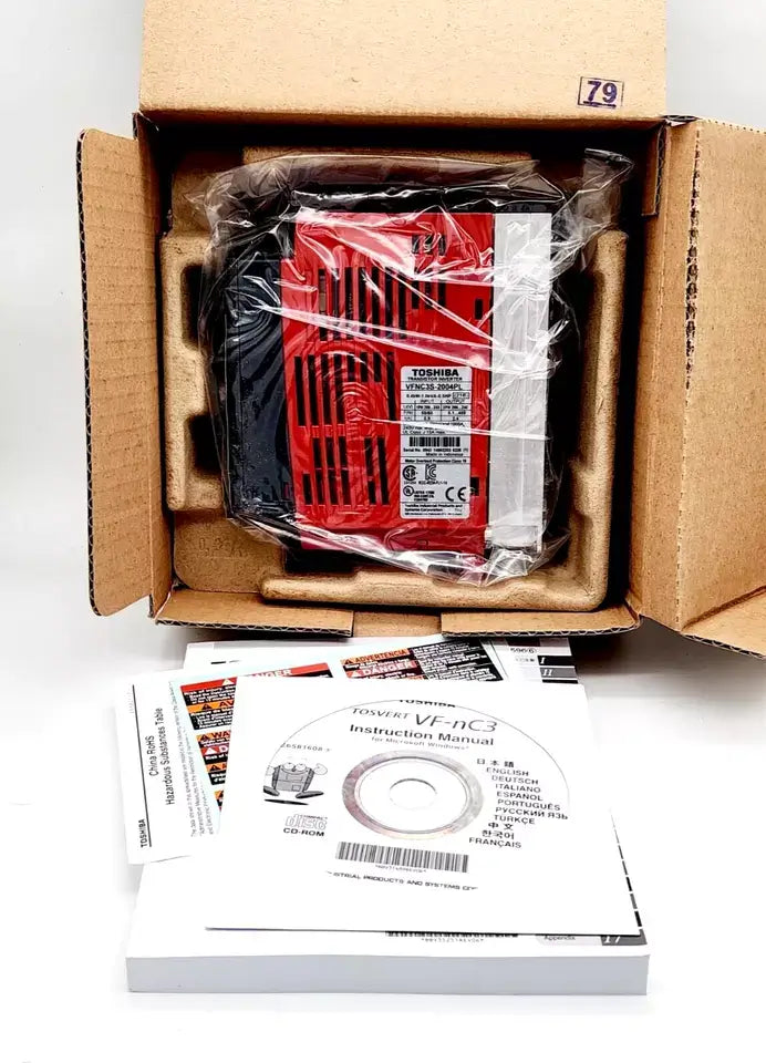 Toshiba VFNC3S-2004PL frequency inverter packaged with manuals and CD, featuring technical specifications and accessories.