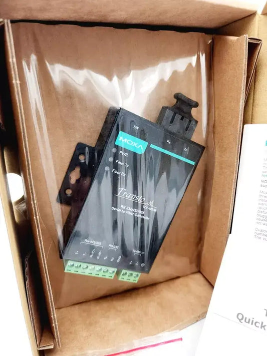 Moxa TCF-142-M-SC-T media converter in original packaging, featuring RS-232 RS-485 interfaces and SC multimode connection.