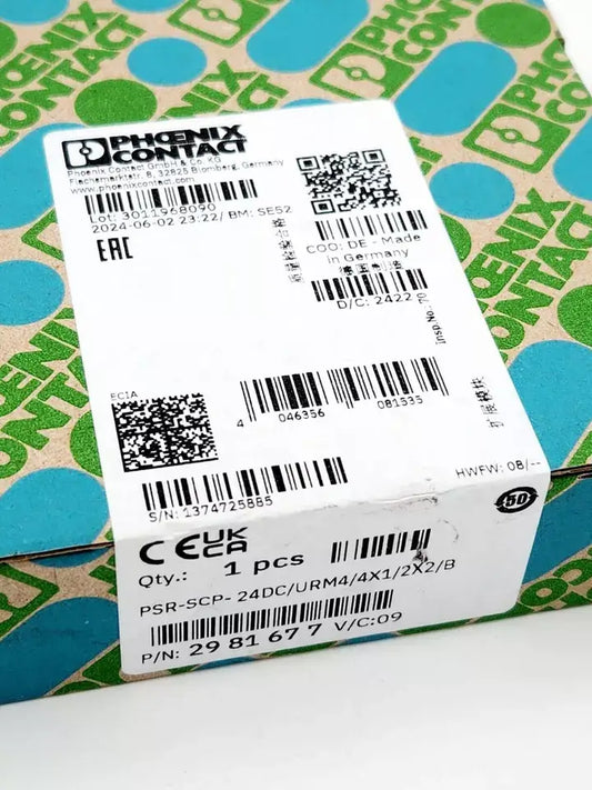 Box of Phoenix Contact 2981677 Erweiterungsmodul PSR-SCP-24DC/URM4/4X1/2X2/B with product labels and QR code.