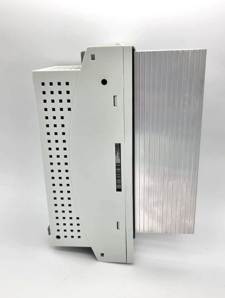 Side view of Lenze 13470118 ECSEA004C4B Achsmodul 4.0A in original packaging with manual, servo drive module, new condition.