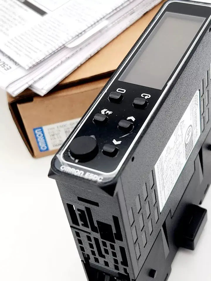 Omron E5DC-QX2DBM-002 digital temperature controller with push-in plus terminal block and RS-485 communication interface.