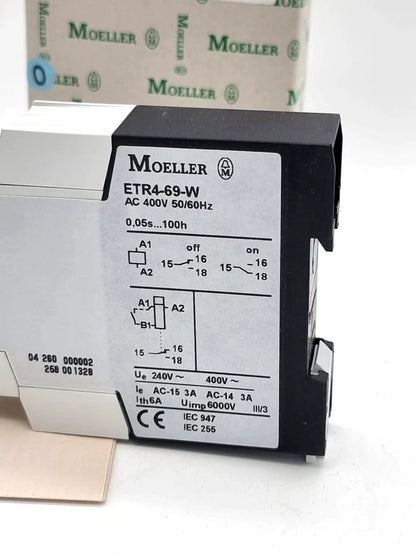 Moeller / Eaton ETR4-69-W Elektronisches Zeitrelais 400V AC, neu, originalverpackt, mit Bedienungsanleitung abgebildet.