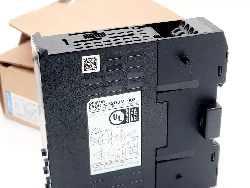 Omron E5DC-QX2DBM-002 Digital Temperature Controller showing product label and UL certification.