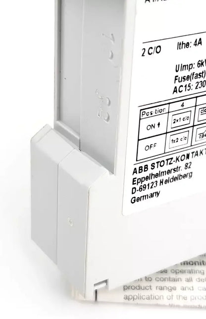 Side view of ABB CM-TCS.11S temperature monitoring relay showing configuration details and LED display panel.