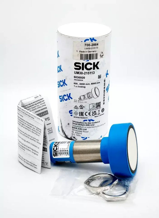Sick 6036920 UM30-215113 ultrasonic distance sensor in package with instructions and components.