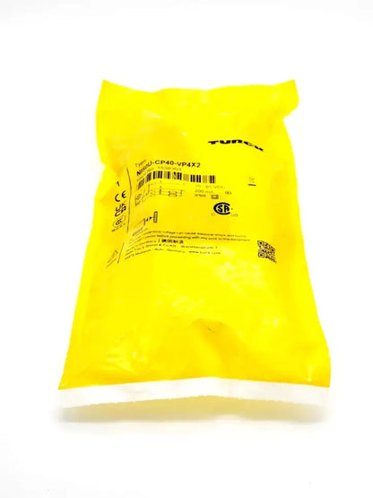 Yellow packaging of Turck 1538303 NI5U-CP40-VP4X2 Induktiver Sensor with product label and details visible.